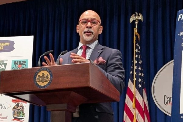 Representative Rabb speaks at the press conference.